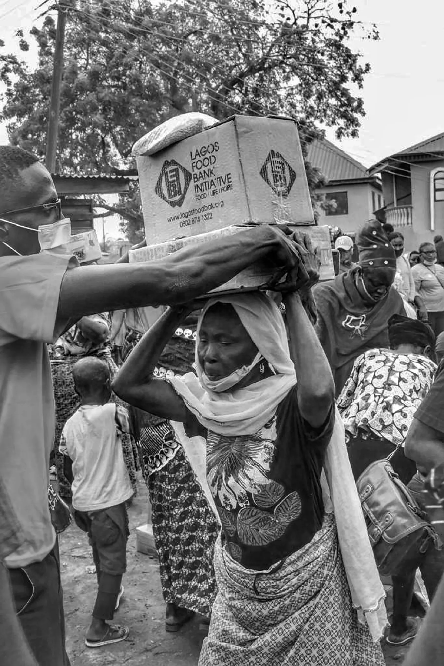Volunteers preparing food parcels in a community setting